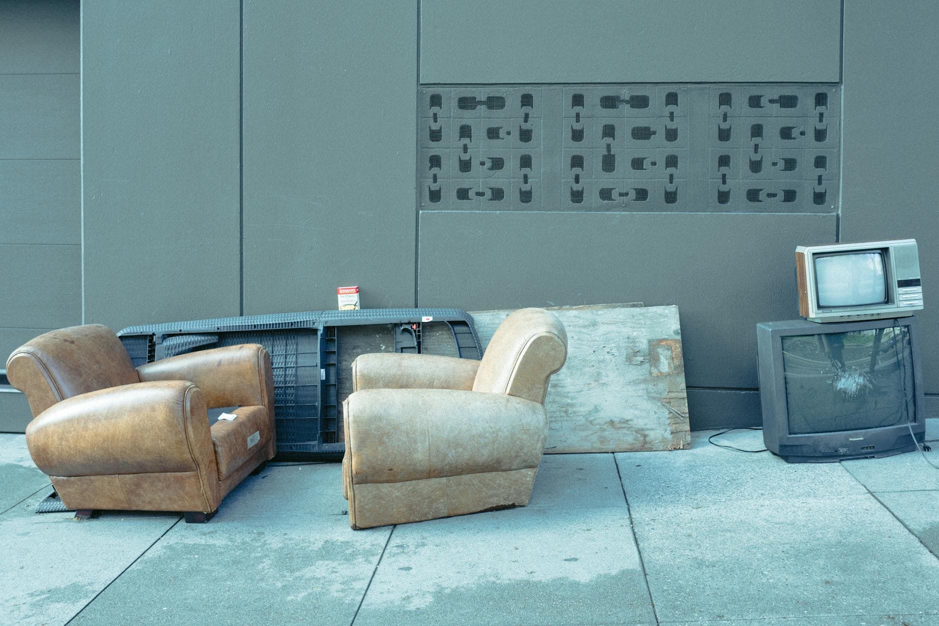 Curbside pile of old furniture waiting for junk removal pickup in Pittsburgh